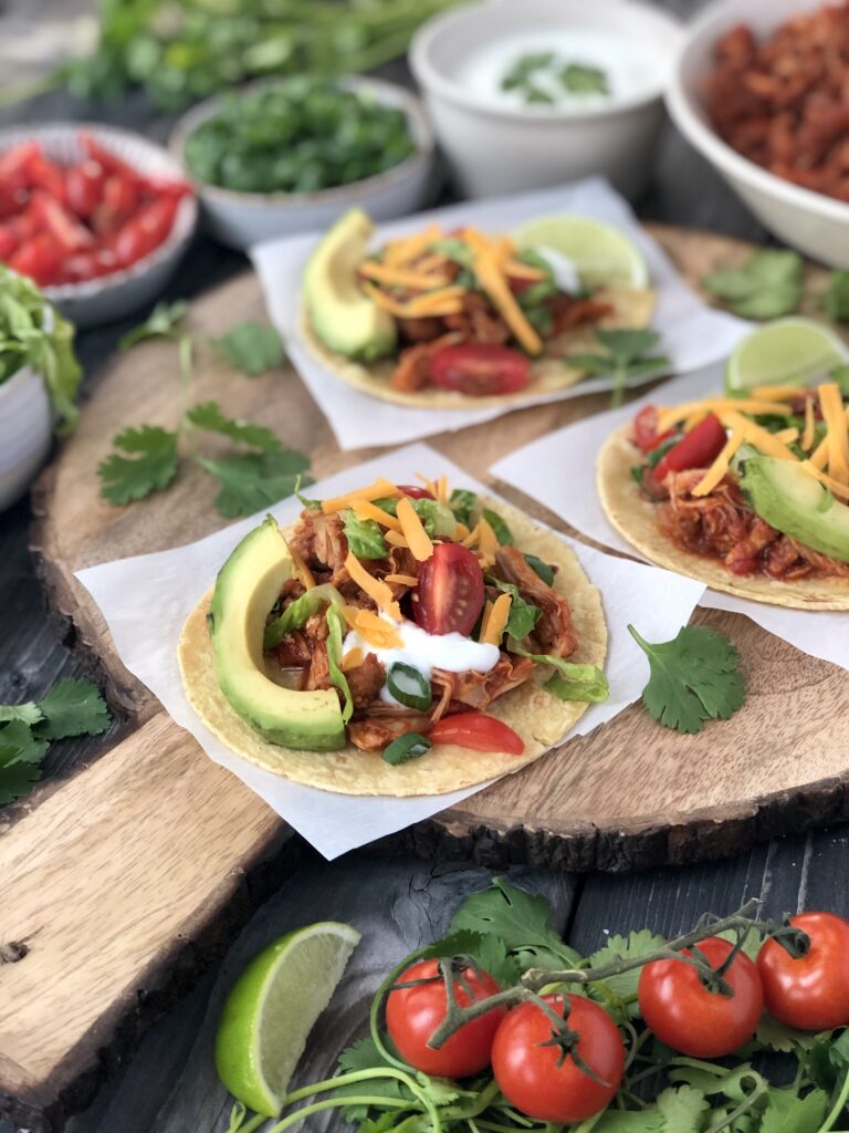 Three corn tacos with tinga poblana filling