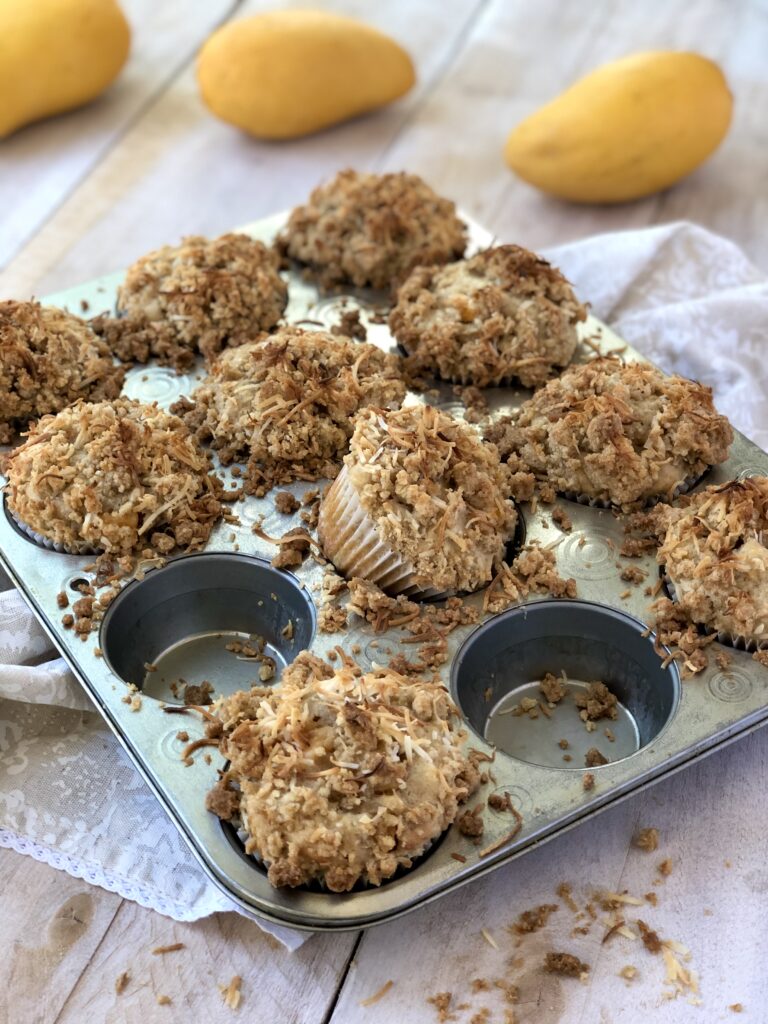 Mango Coconut Muffins in a muffin tin