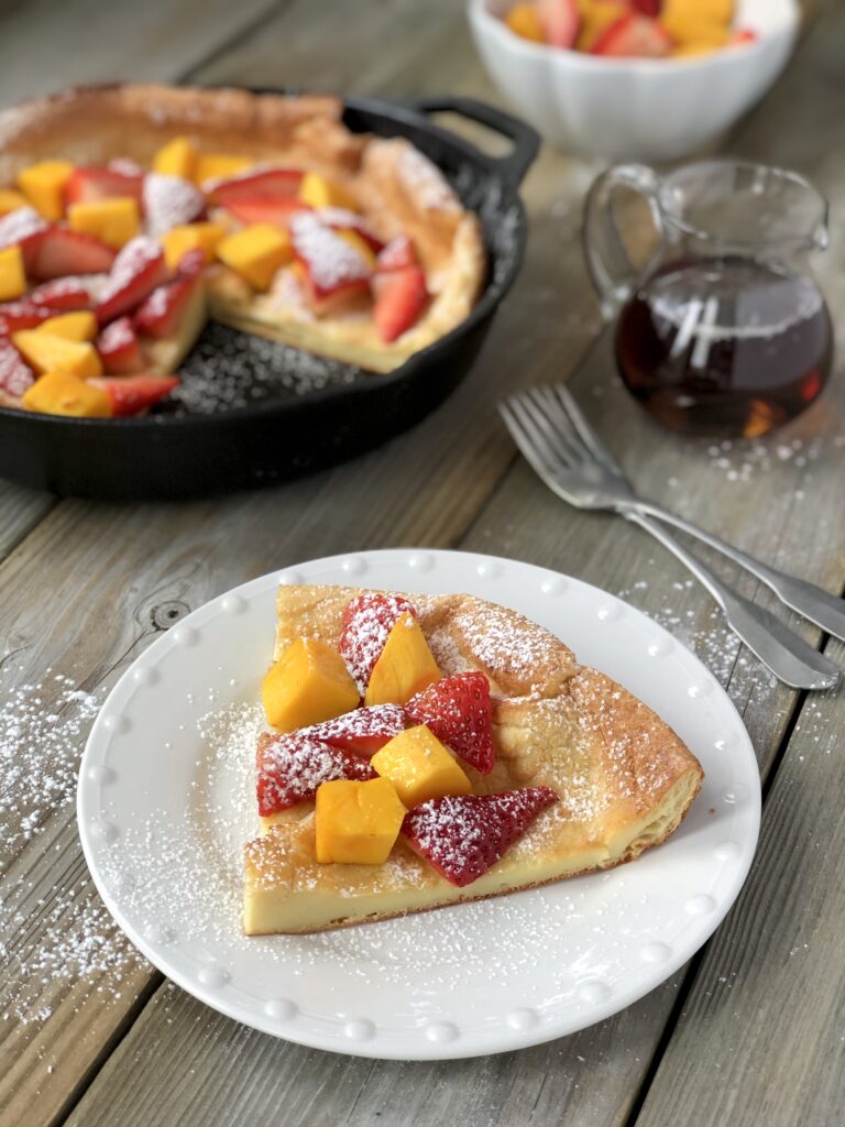 Slice of dutch baby pancake on plate