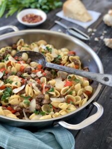 Orecchiette Pasta in pan with serving spoon