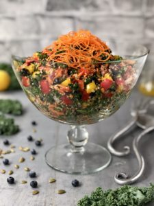 Kale salad in glass serving bowl