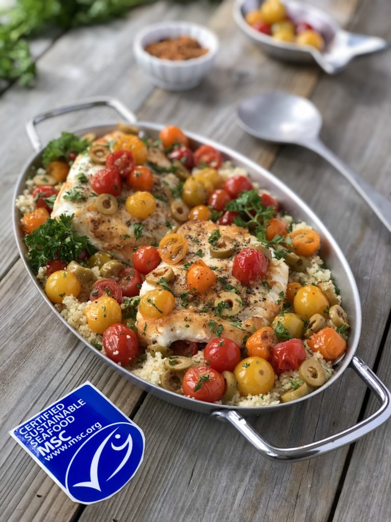 Halibut fish in a serving dish with MSC logo