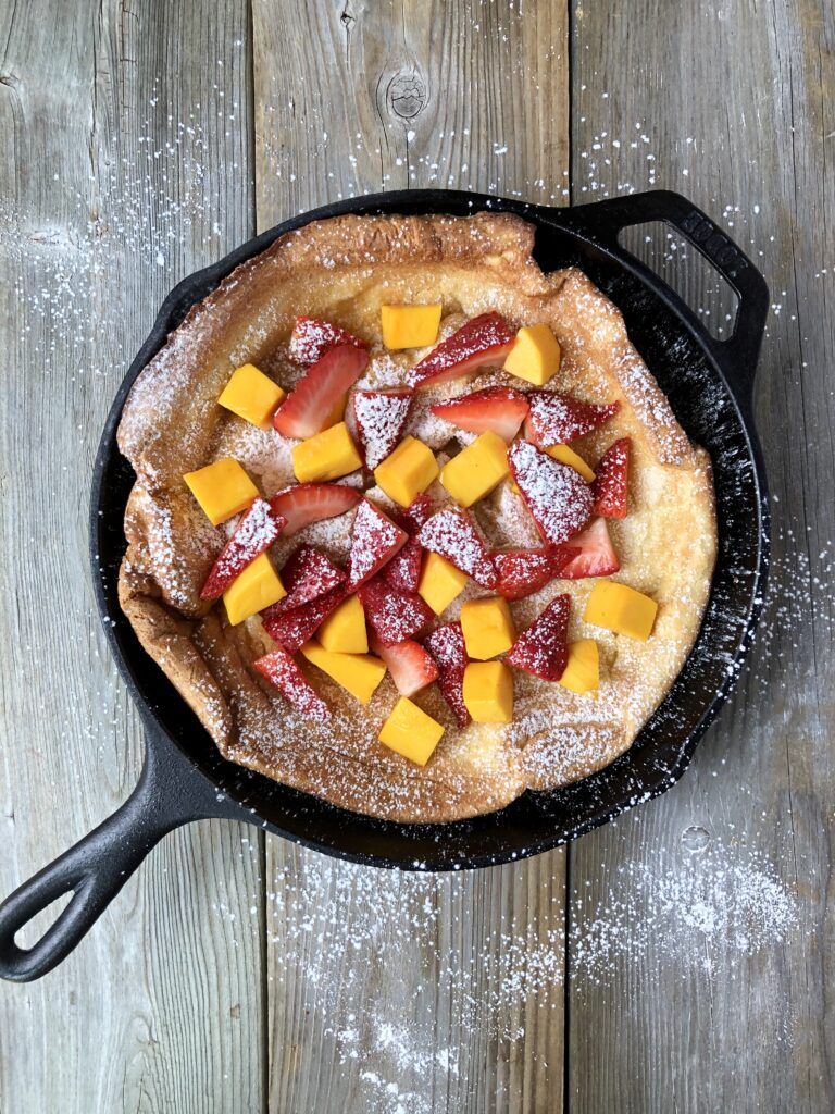 https://www.kitchenfairy.ca/wp-content/uploads/2020/05/Dutch-Baby-Pancake-7-BEST-Whole-Skillet-with-Fruit-Flatlay-768x1024.jpeg