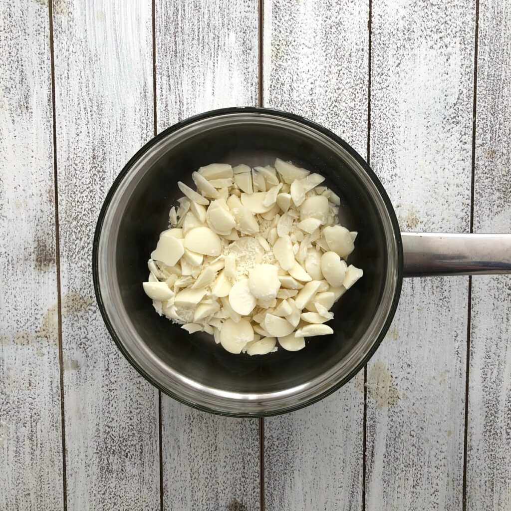 Chopped white chocolate in a pot