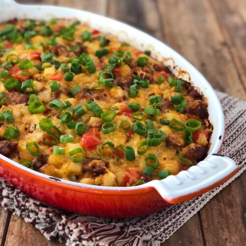 Square image of sausage hash brown casserole out of the oven.